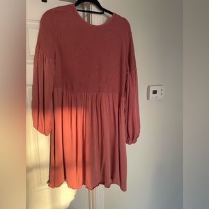 Mauve smocked dress. Button loop on the back is loose but still attached.